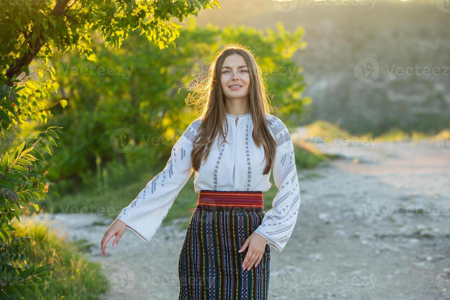Beautiful traditional costume from Republic of Moldova. Young girl wearing Romanian traditional blouse. photo