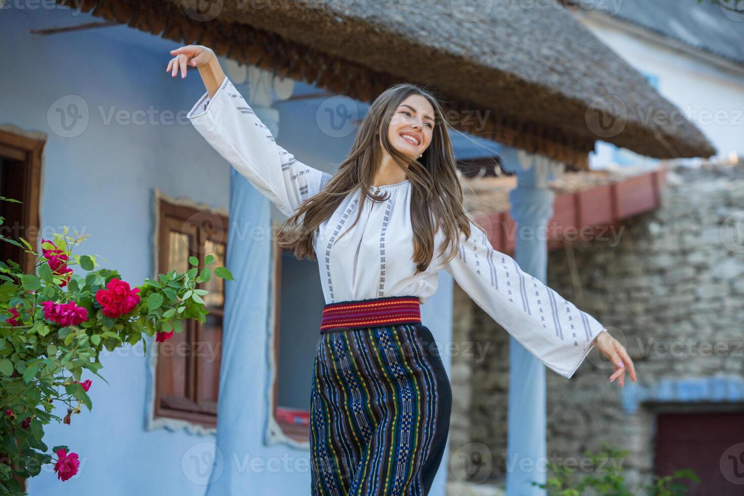 Beautiful traditional costume from Republic of Moldova. Young girl wearing Romanian traditional blouse. photo