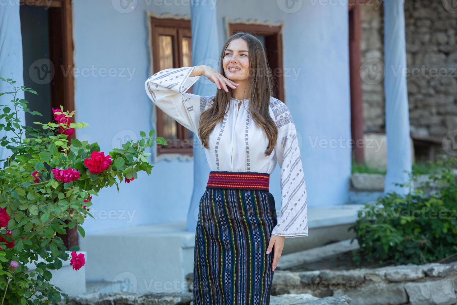 Beautiful traditional costume from Republic of Moldova. Young girl wearing Romanian traditional blouse. photo