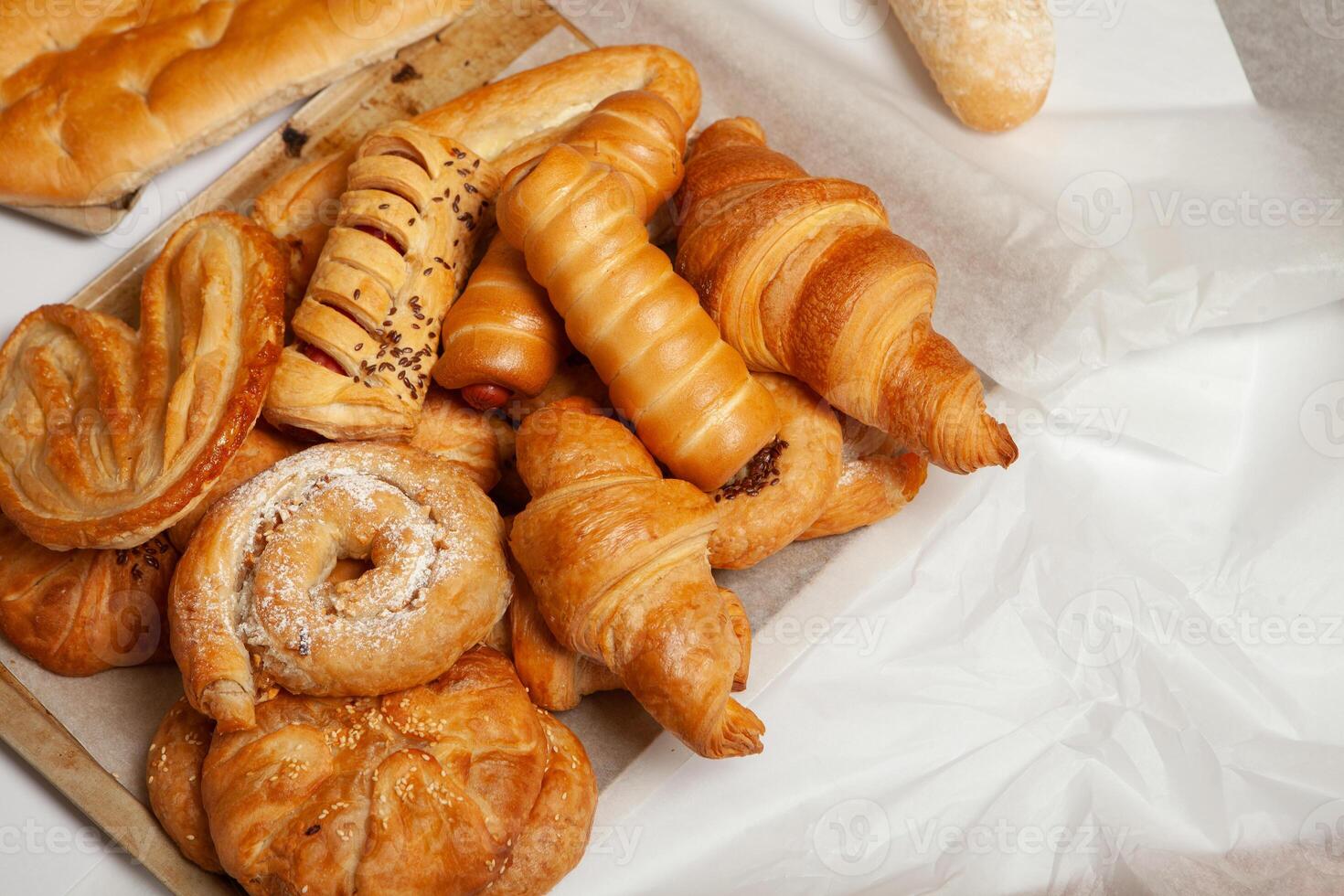 Collection of cakes and different pies with cheese, apple, cherry, meat and cabbage on a plate. Bakery goods. Sweet pastries. photo