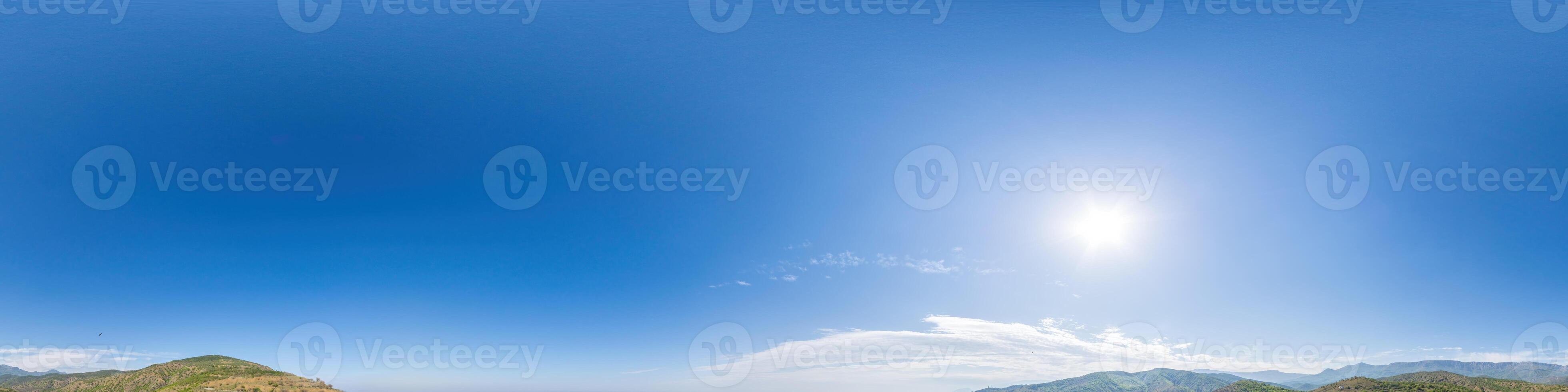 Blue sky with light clouds Seamless panorama in spherical equirectangular format with complete zenith for use in 3D graphics, game and for composites in aerial drone 360 degree panoramas as a sky dome photo