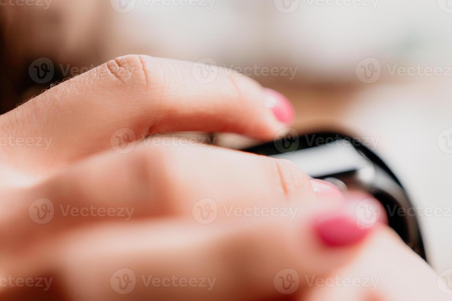 Woman hand using smart watches mobile app with touch screen. New gadget to stay connected to internet. Stylish touchscreen wrist watches with navigation mobile application. Close up. Selective focus photo