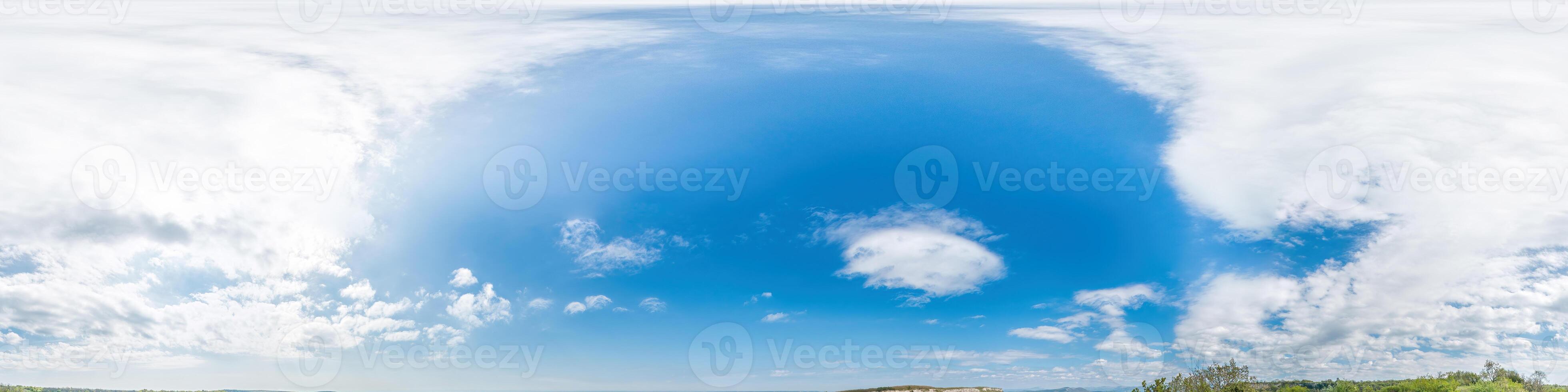 Seamless panorama of sky with light clouds in spherical equirectangular format with complete zenith for use in 3D graphics, game and for composites in aerial drone 360 degree panoramas as a sky dome. photo