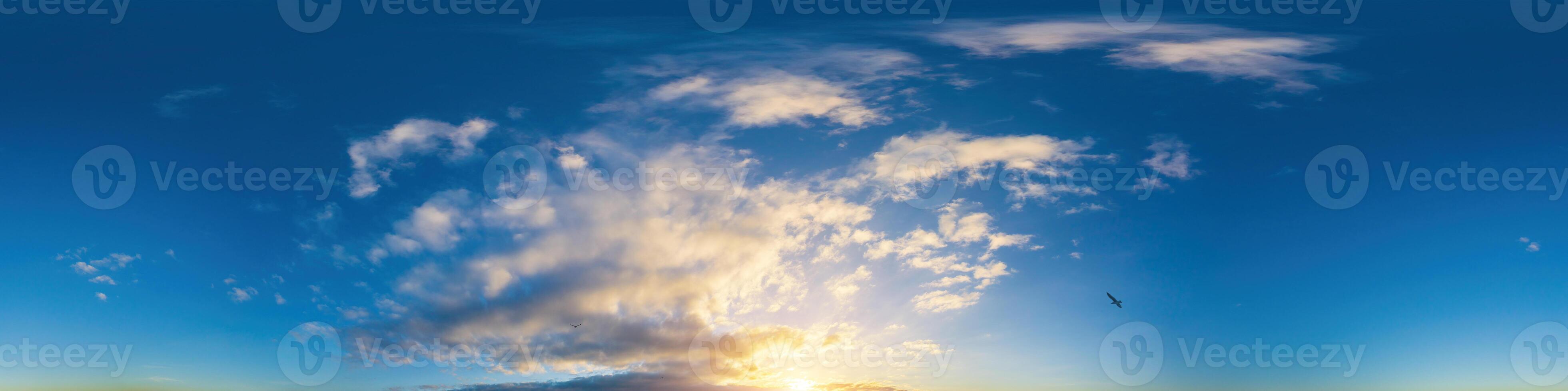 Dark blue sunset sky panorama with Cumulus clouds. Seamless hdr pano in spherical equirectangular format. Complete zenith for 3D visualization, game and sky replacement for aerial drone 360 panoramas. photo