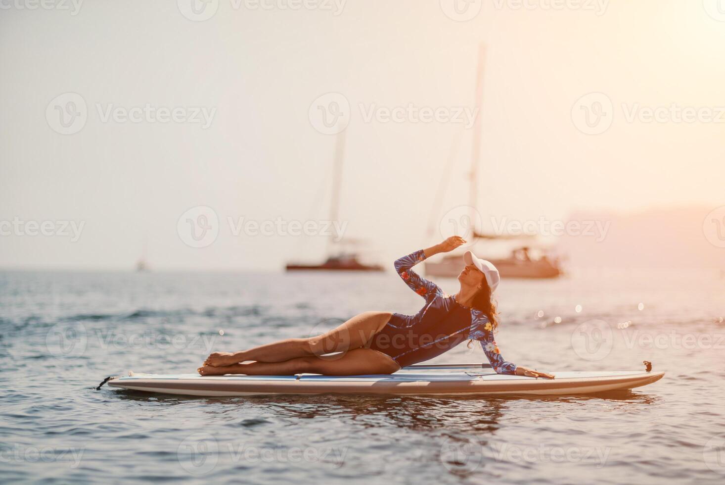 Woman sup yoga. Middle age sporty woman practising yoga pilates photo
