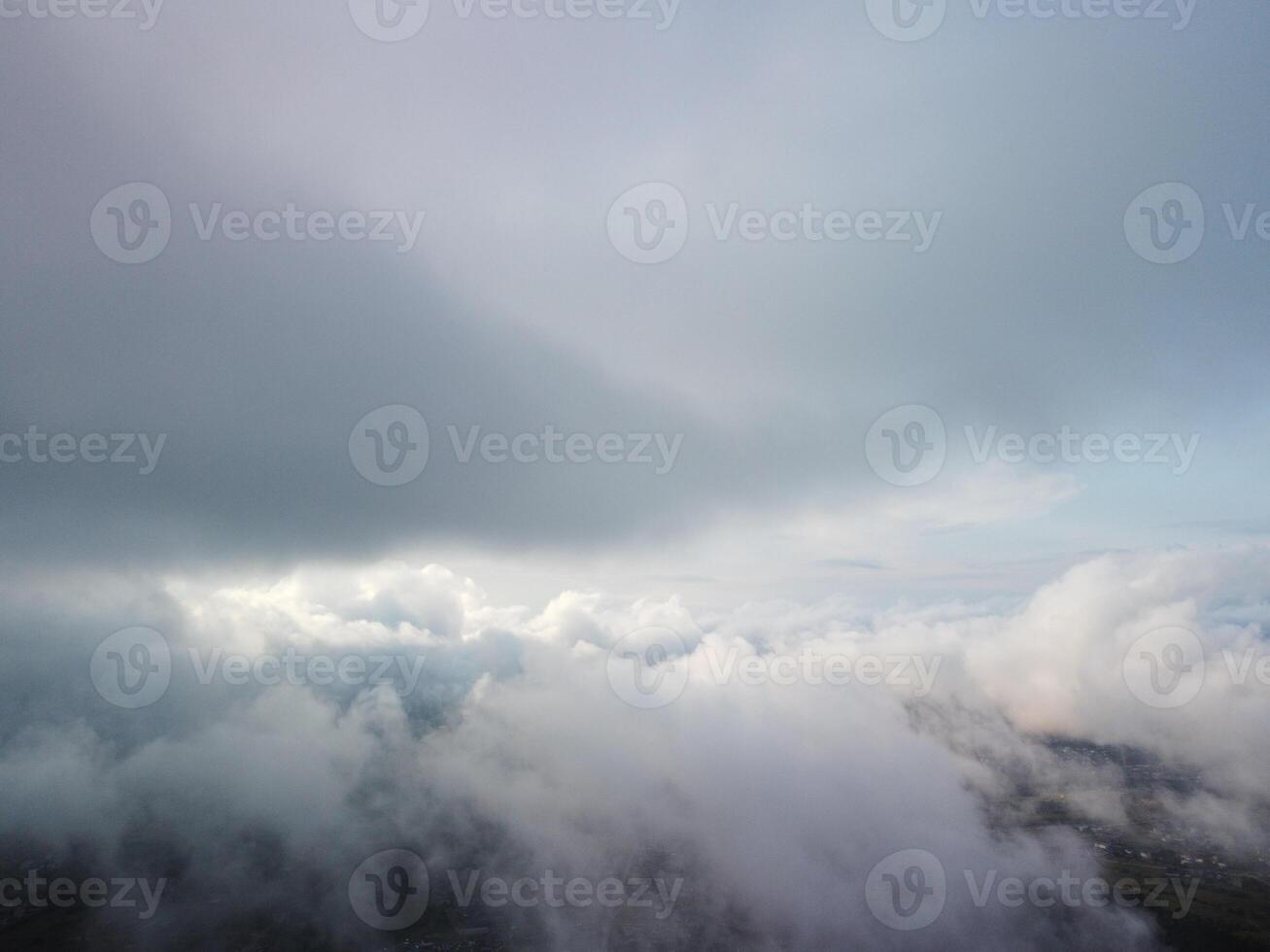 Aerial view. Blue sky sun and fog over calm sea. The drone flies over foggy and fluffy clouds. Abstract aerial nature summer ocean sunset sea and sky background. Vacation, travel and holiday concept. photo