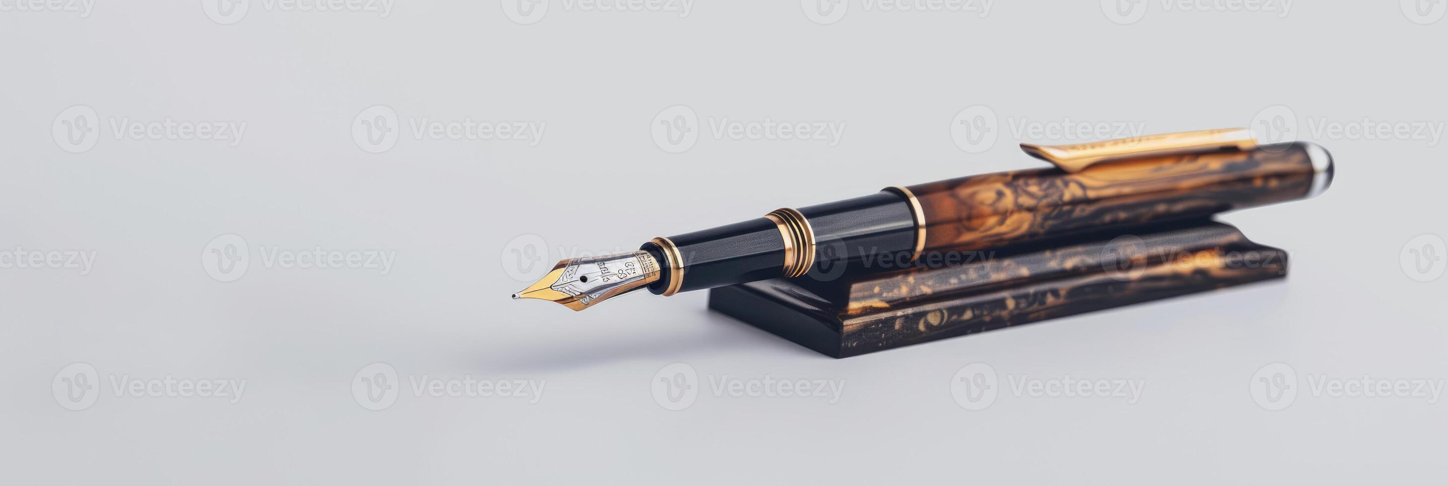 Classic luxury fountain pen on wooden stand isolated on grey background photo