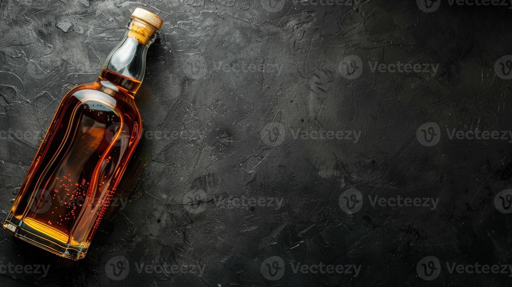 Whiskey bottle, alcohol drink isolated on black background with copy space photo