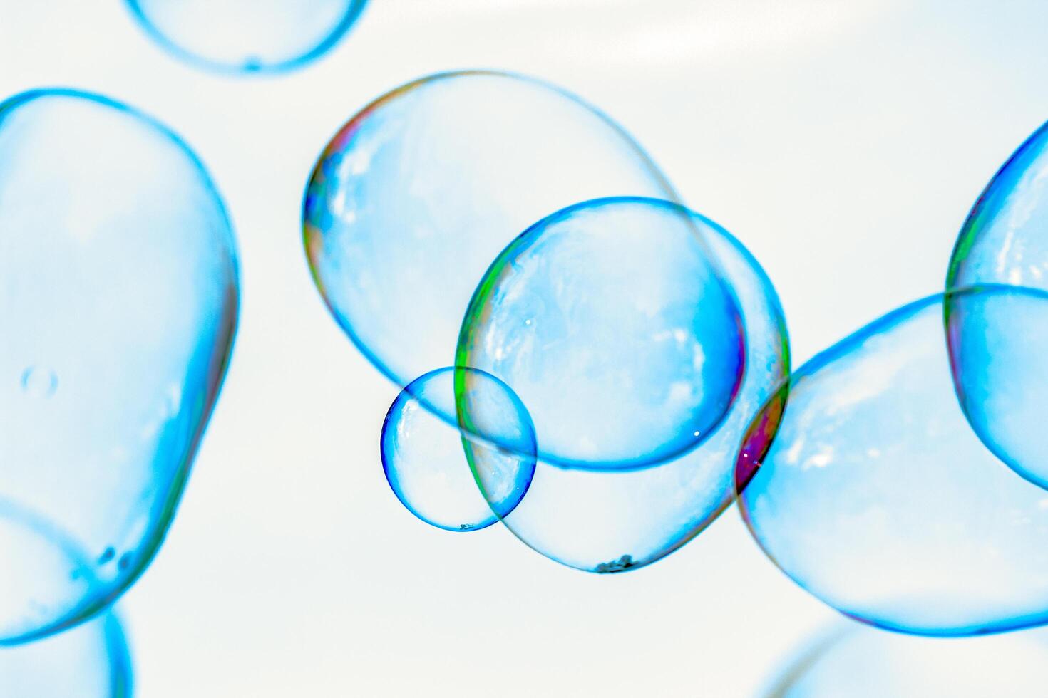 soap bubbles against the sky, reflection of the sun in the bubbles, color play, abstraction photo