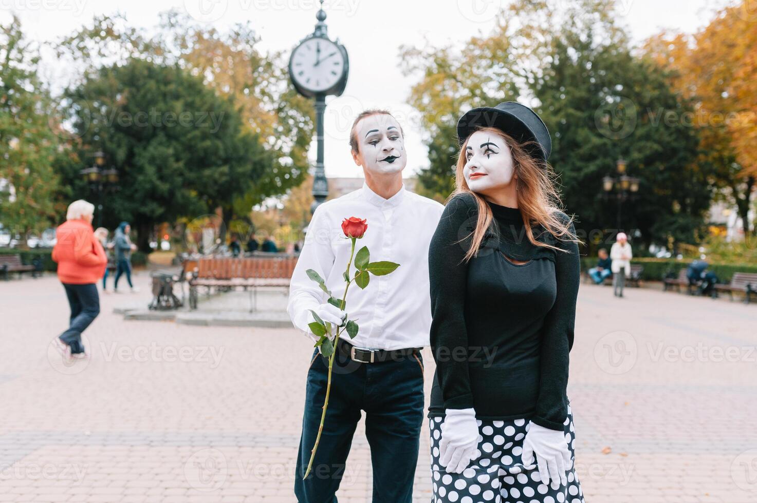 Mime on the street waiting to meet with his lover. Portrait of a mime comedian. mime on the street photo