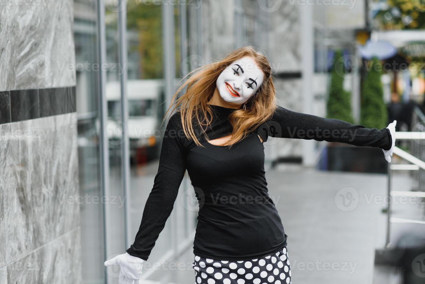 The girl with makeup of the mime. improvisation. mime shows different emotions photo