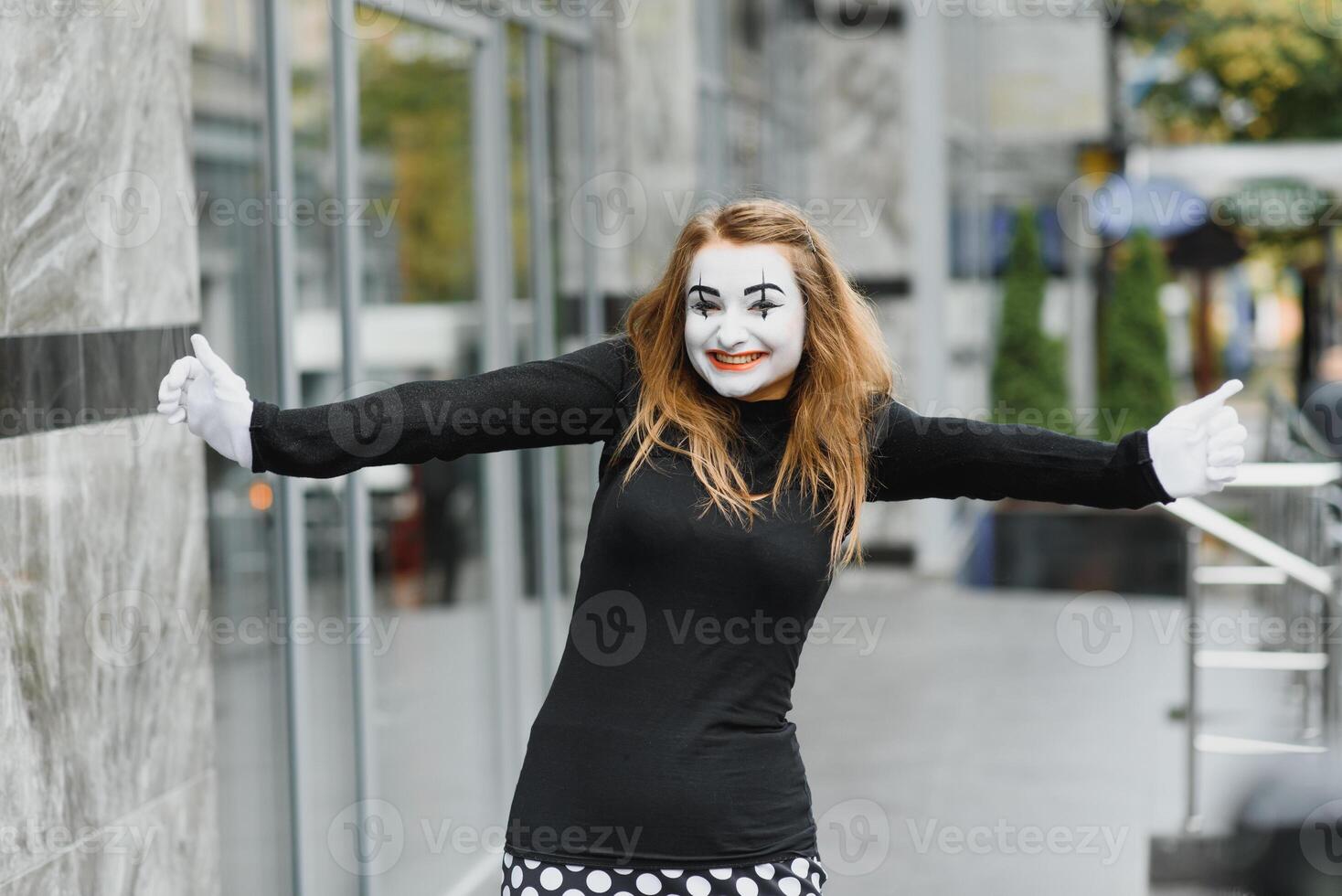 Portrait of a mime comedian. mime girl on the street photo