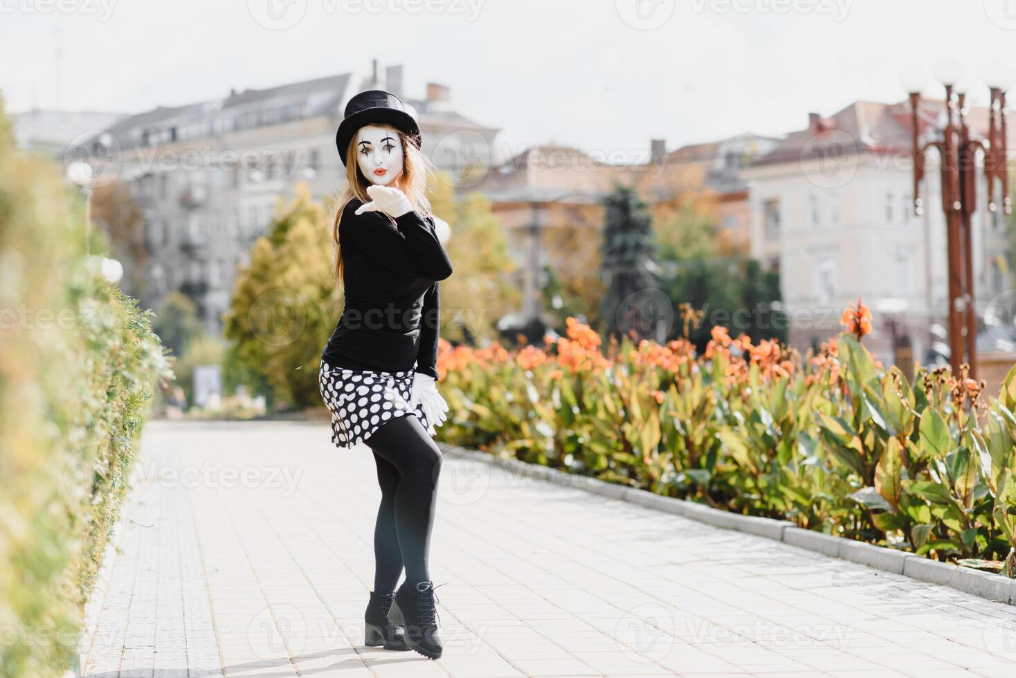 The girl with makeup of the mime. improvisation. mime shows different emotions photo