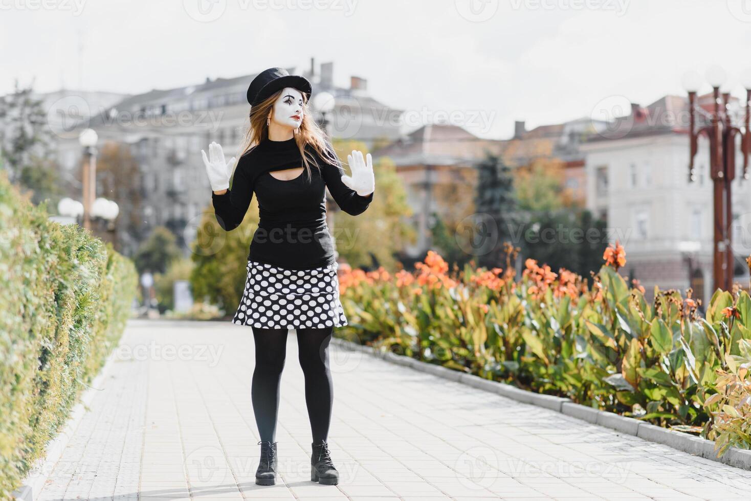 Portrait of a mime comedian. mime girl on the street photo
