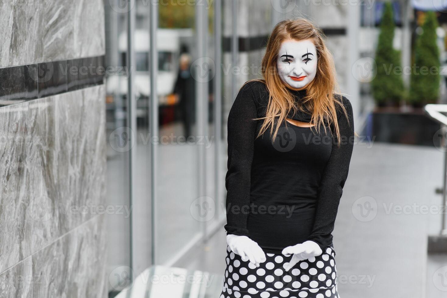 The girl with makeup of the mime. improvisation. mime shows different emotions photo