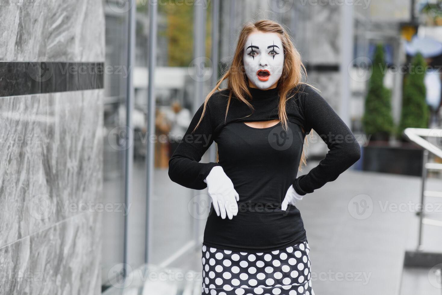 The girl with makeup of the mime. improvisation. mime shows different emotions photo