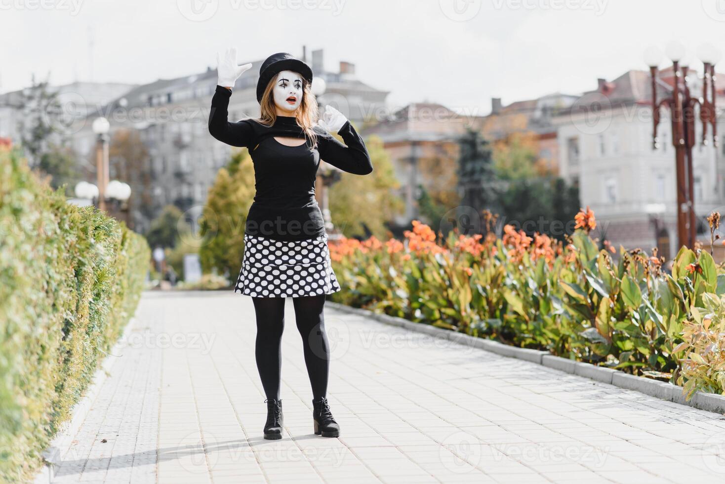 Portrait of a mime comedian. mime girl on the street photo
