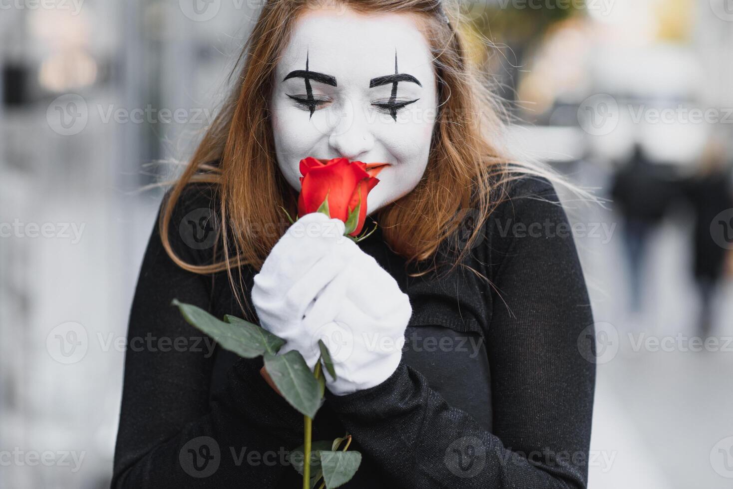 woman mime with red rose photo