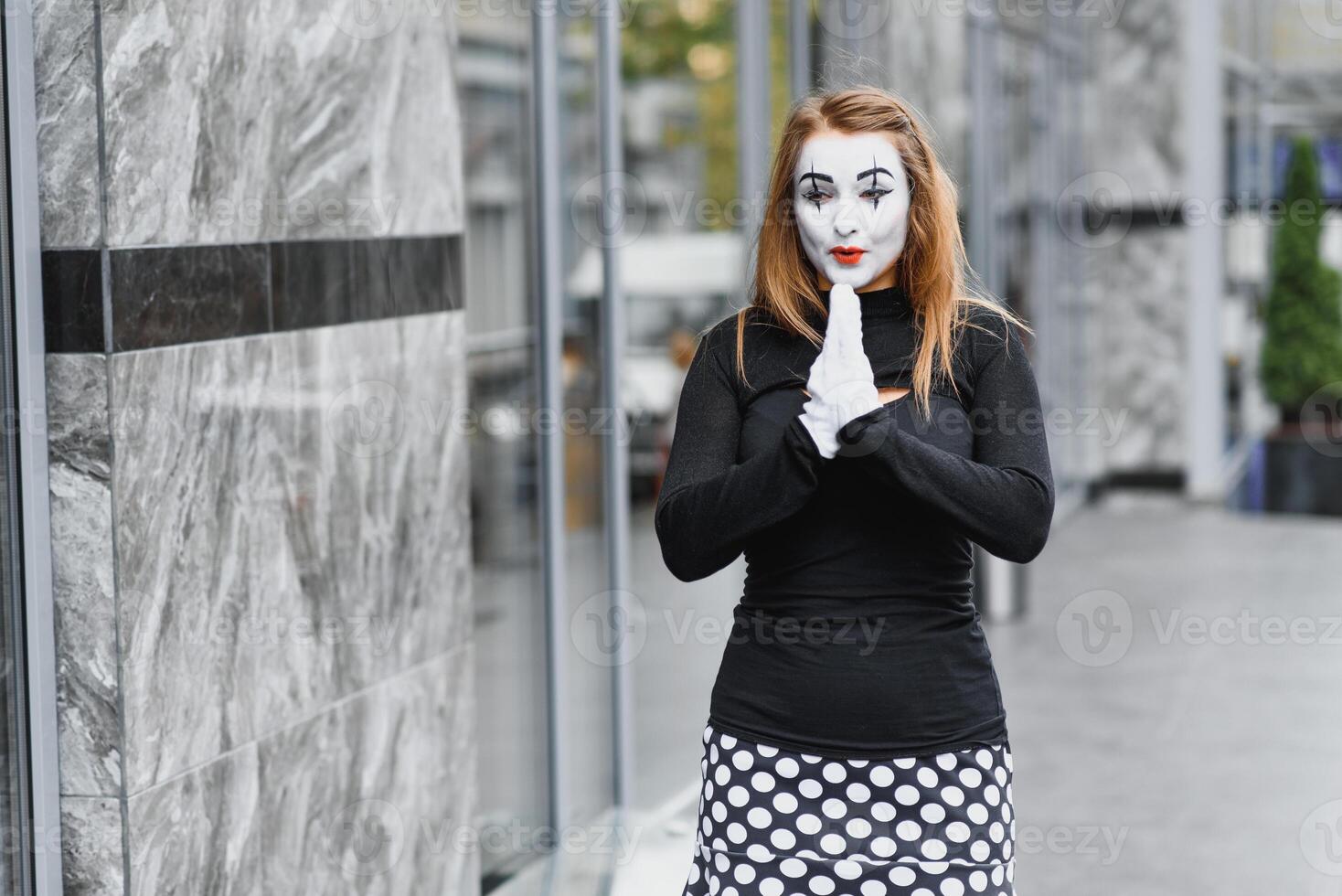 The girl with makeup of the mime. improvisation. mime shows different emotions photo