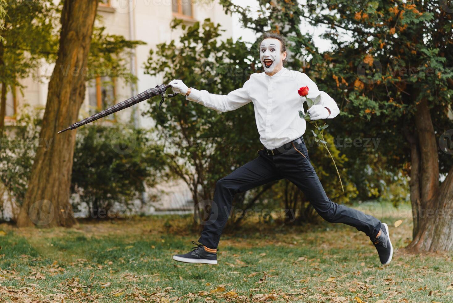 Portrait of a man, artist,clown, MIME. Shows something. Mime actor shows different emotions. photo