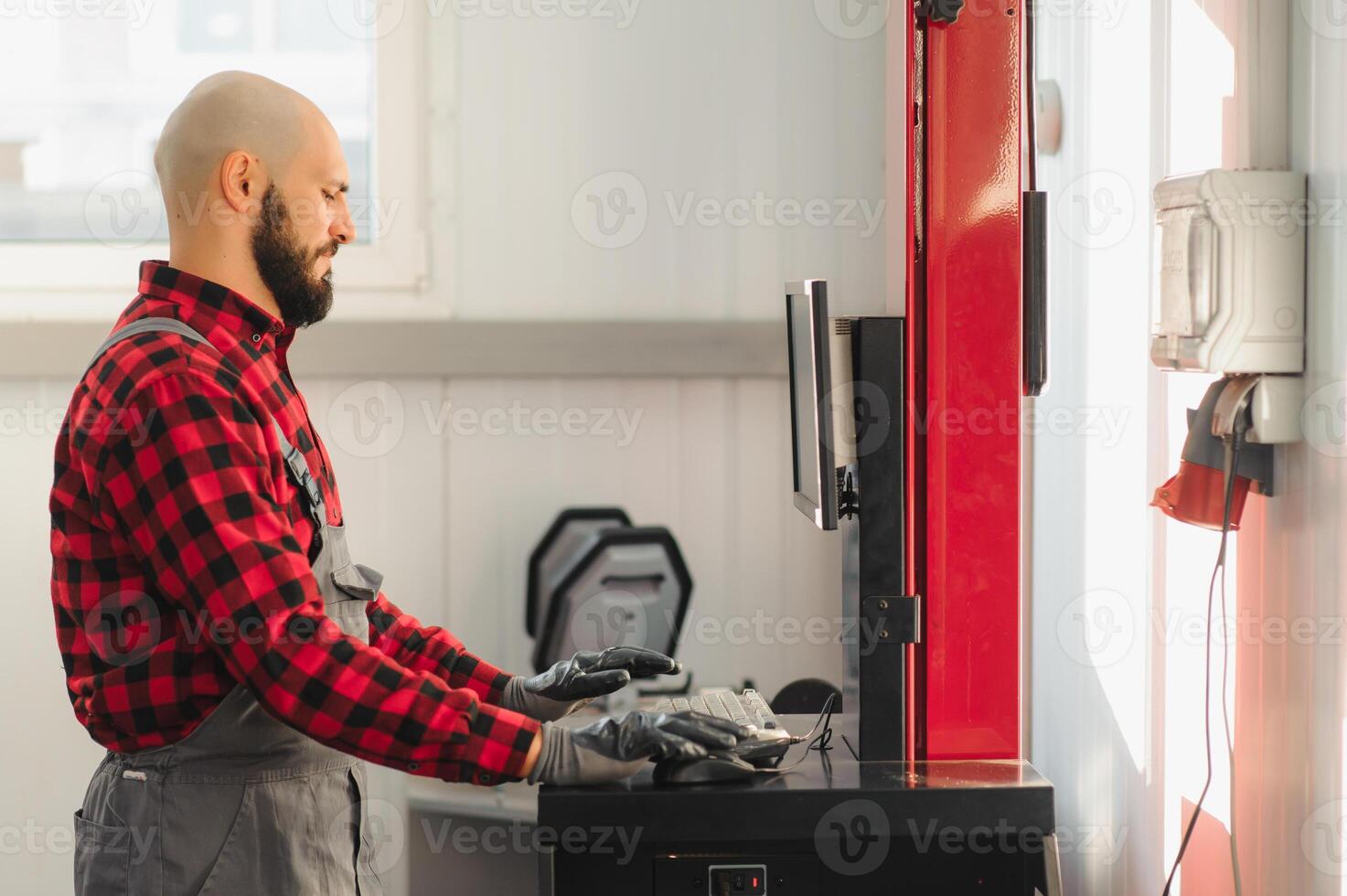 working process of a full system diagnostic scanner that can quickly test every system module s status and make faster diagnosis. mechanic makes computer diagnostics of the car photo