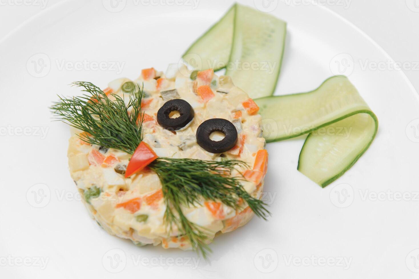 baby salad laid out in the form of a bunny on the plate photo