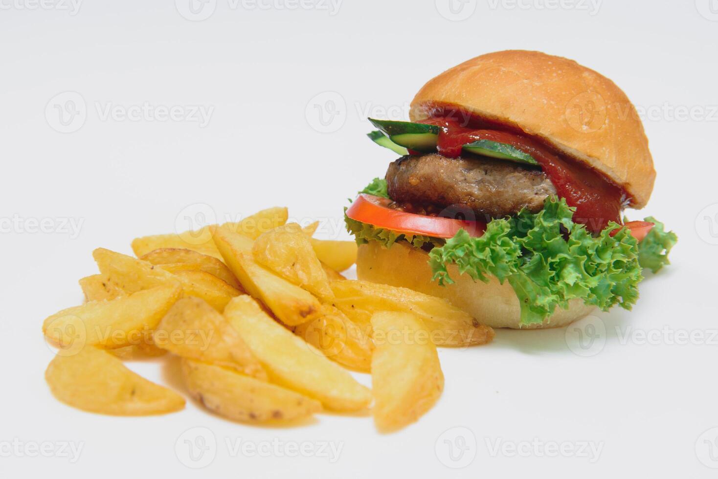 tasty hamburger, French fries and chili sauce on white plate, Fast food with copy space photo