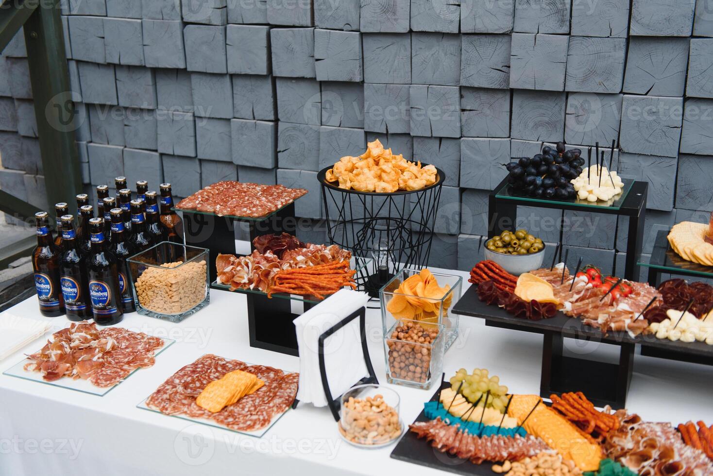 Meat and cheese appetizers. Antipasti and catering platter with different meat and cheese products. photo