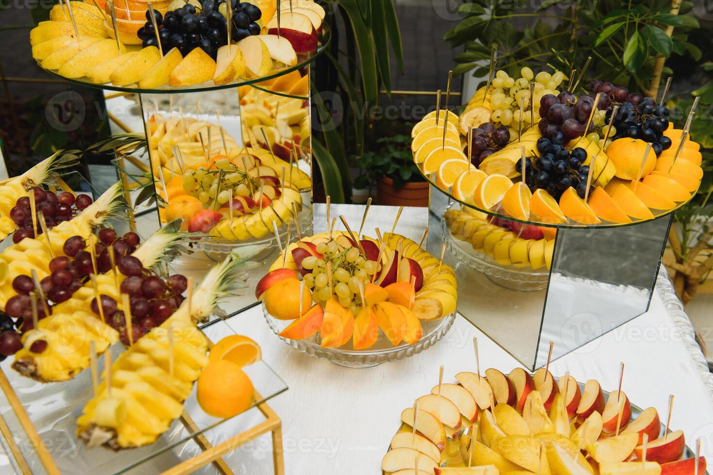 desserts with fruits, mousse, biscuits. Different types of sweet pastries, small colorful sweet cakes, macaron, and other desserts in the sweet buffet. candy bar for birthday photo