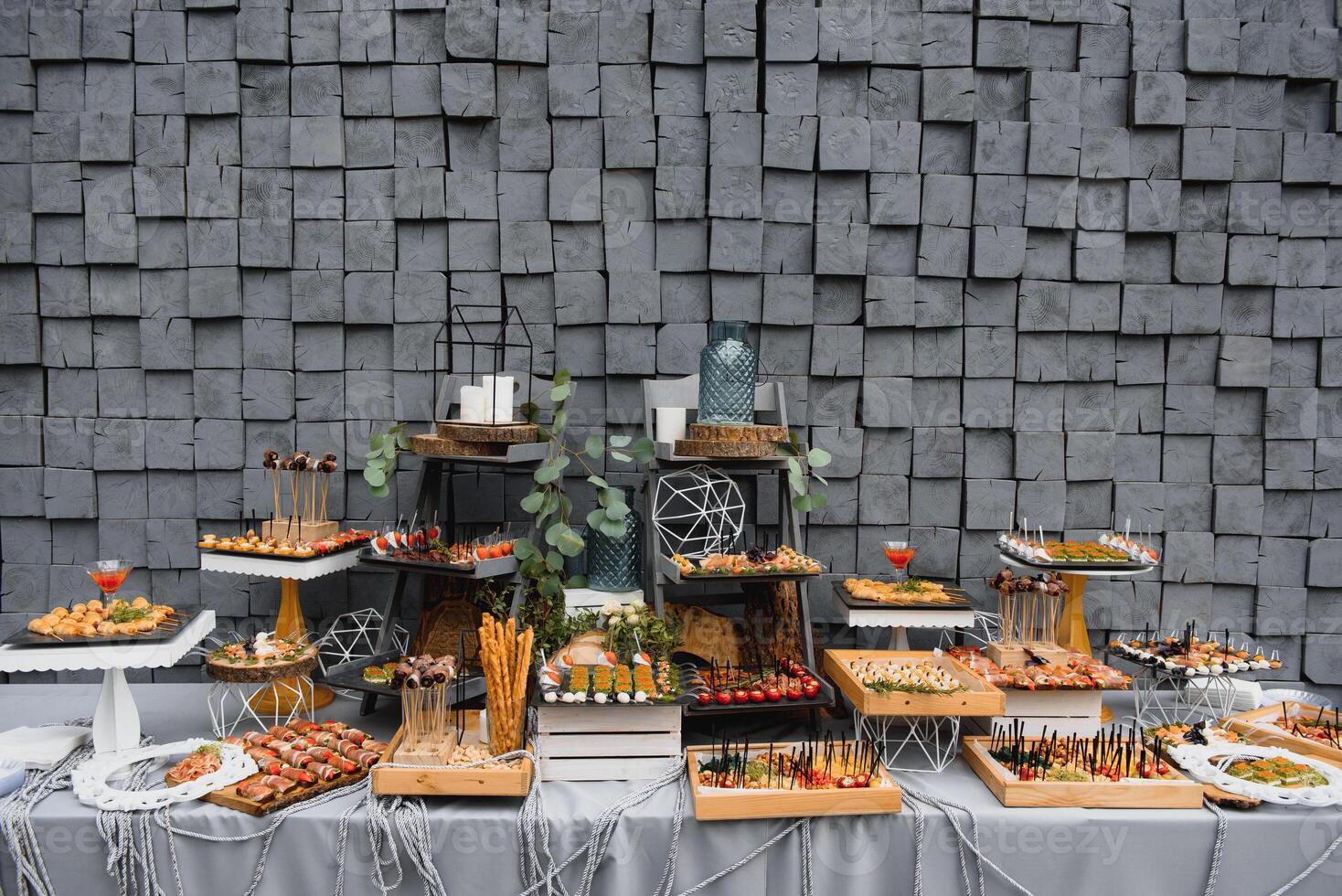 Meat and cheese appetizers. Antipasti and catering platter with different meat and cheese products. photo