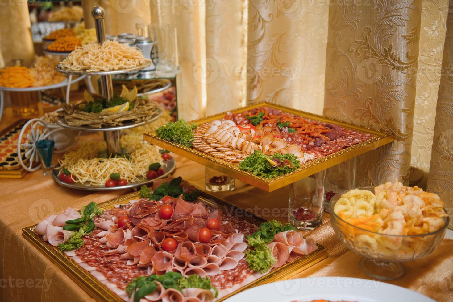 Meat and cheese appetizers. Antipasti and catering platter with different meat and cheese products. photo