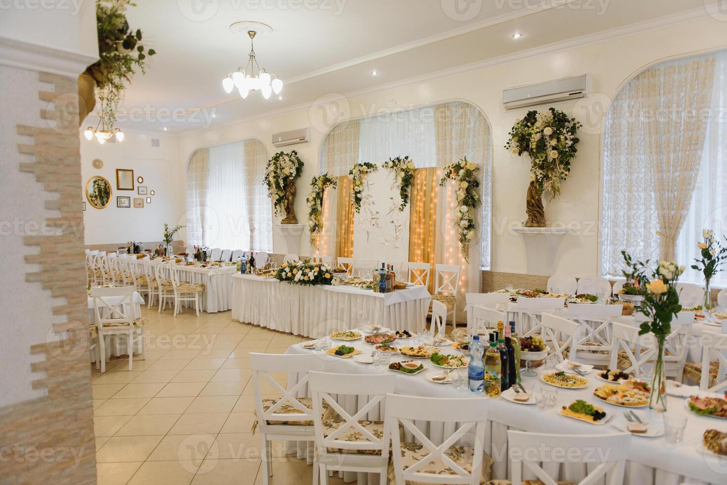 an image of tables setting at a luxury wedding hall photo