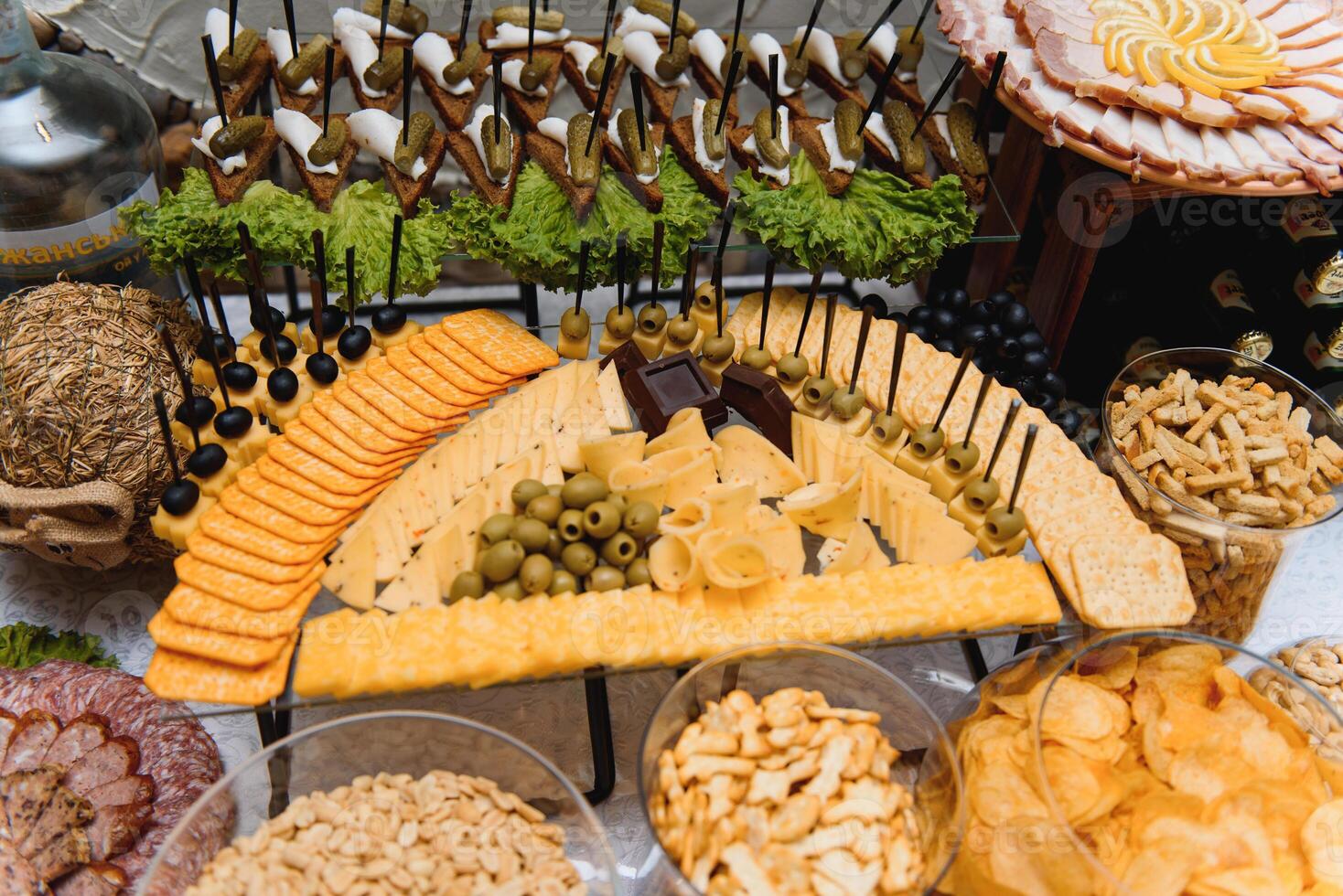Delicious sweets on wedding candy buffet with desserts, cupcakes,tiramisu and cookies photo
