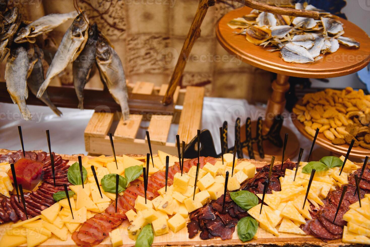 Meat and cheese appetizers. Antipasti and catering platter with different meat and cheese products. photo