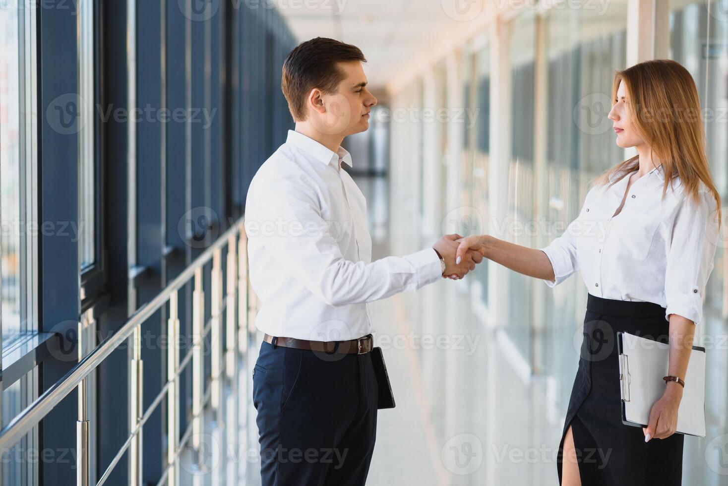 Business people shaking hands, finishing up a meeting photo