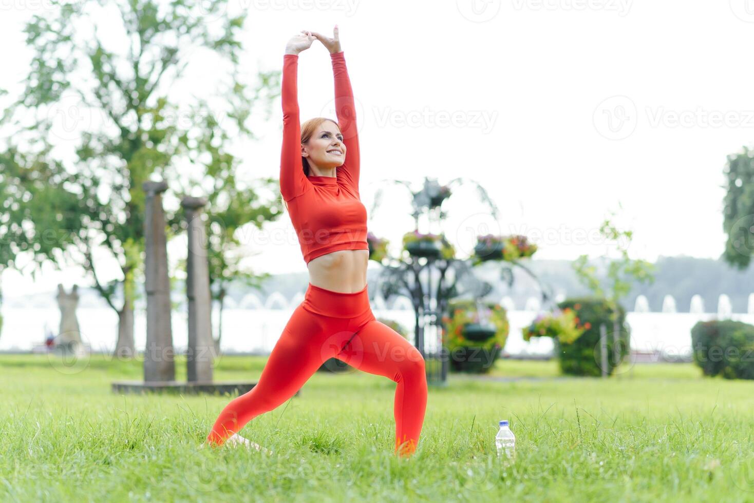 YOGA Beautiful young woman doing yoga in the summer park. Healthy lifestyle. Various yoga postures. photo