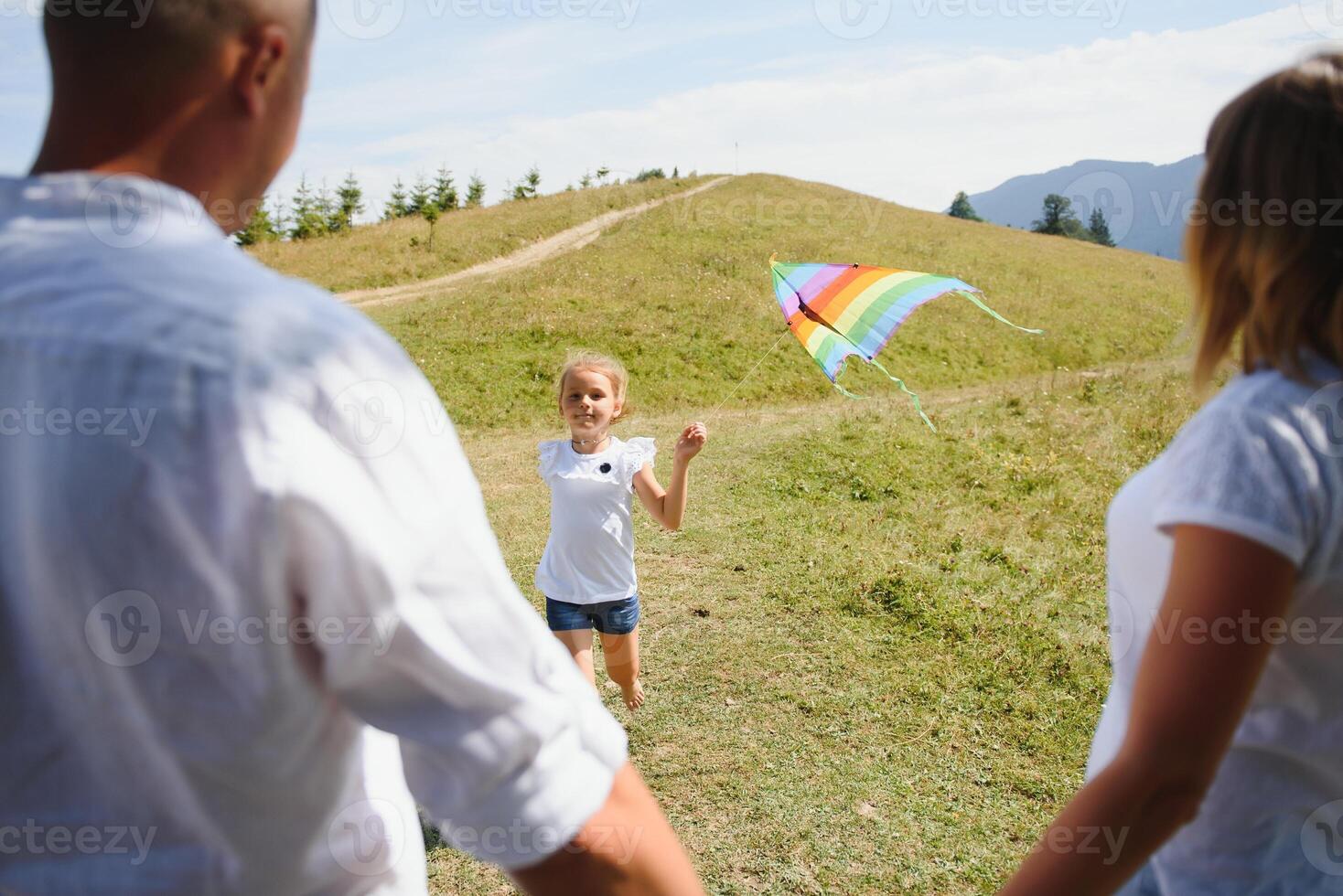 Young family with child resting on a mountain. vacation in the national park photo