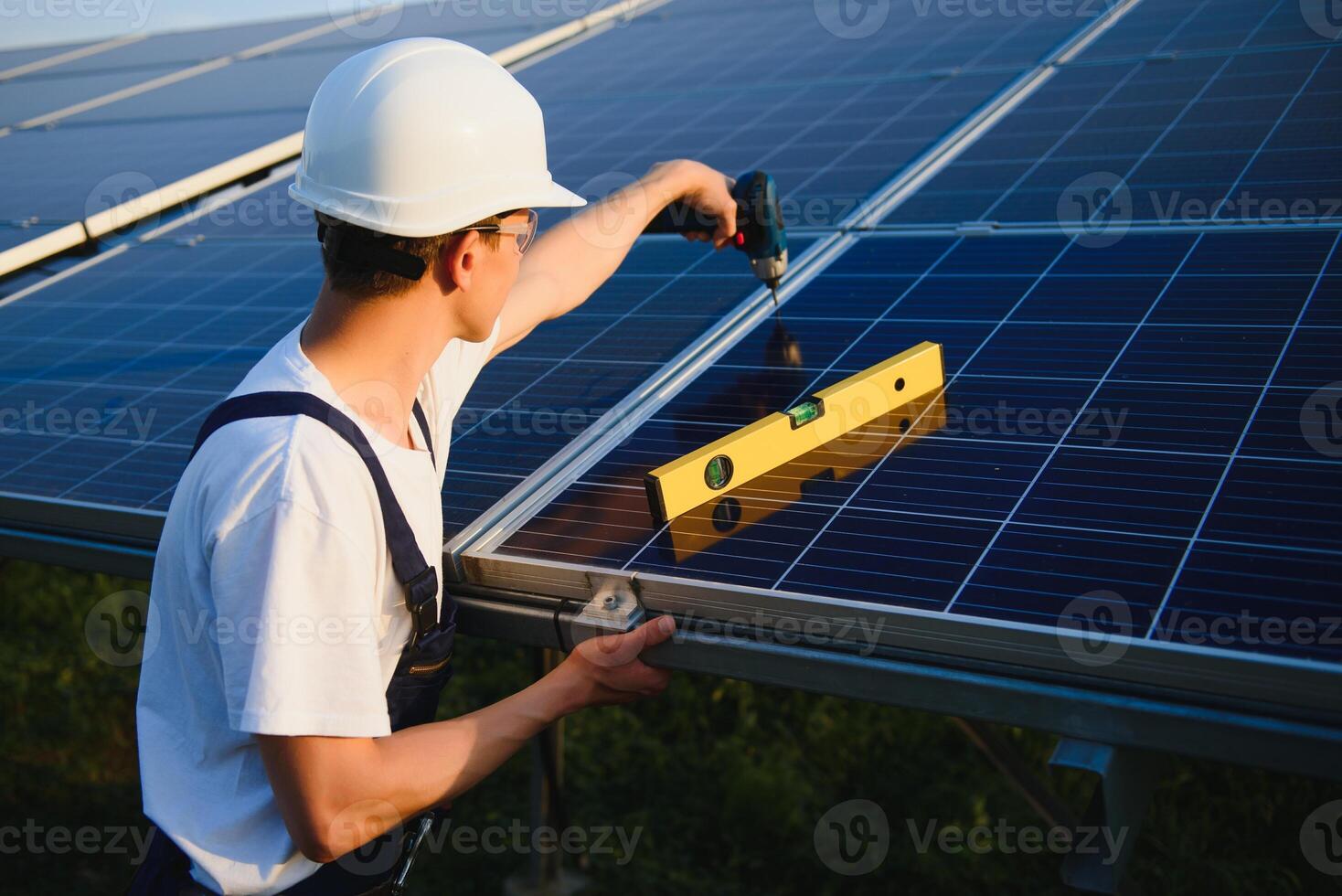 Renewable energy and solar power concept, worker or Electrical engineers are checking and training installing photovoltaic plant in solar power station alternative energy from nature photo