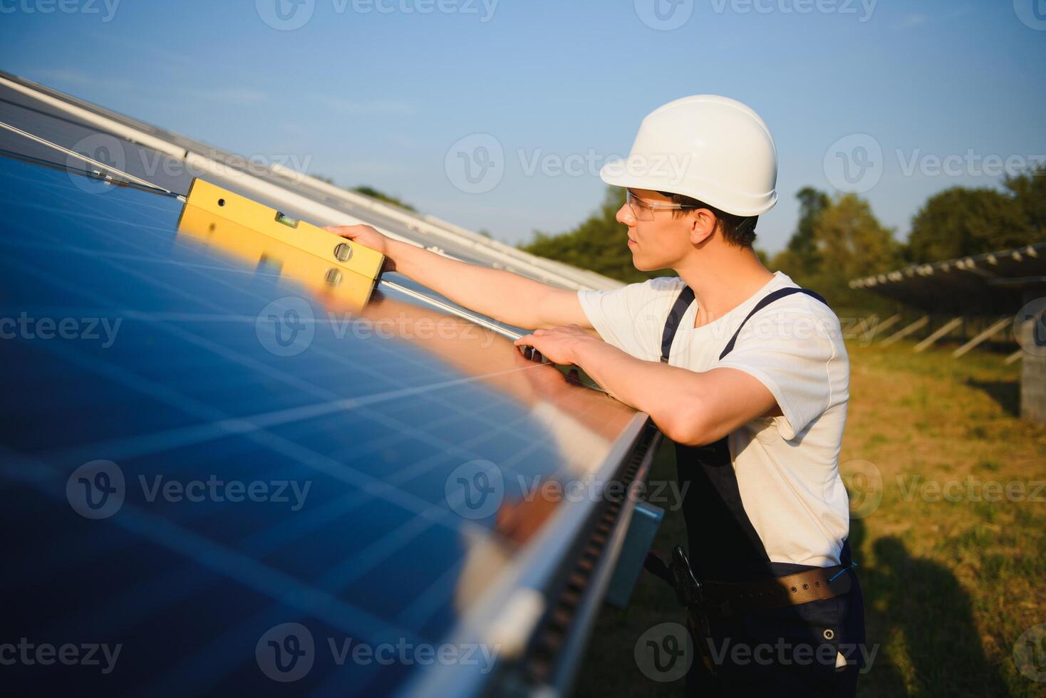 Renewable energy and solar power concept, worker or Electrical engineers are checking and training installing photovoltaic plant in solar power station alternative energy from nature photo