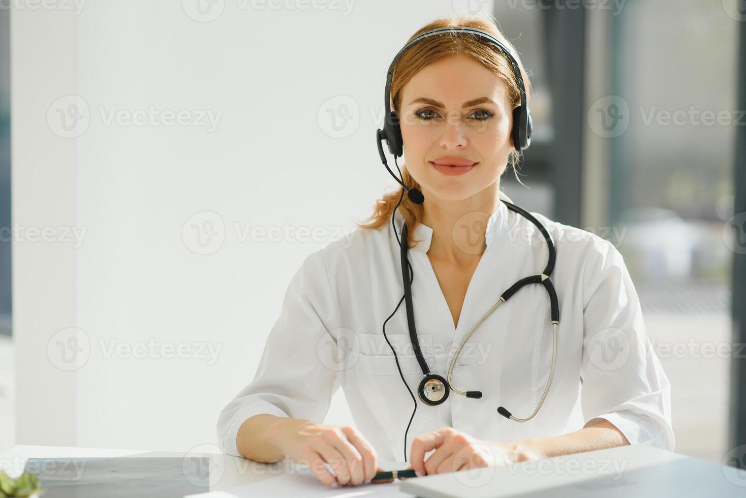 doctor talking with sick person through laptop online system and using mobile digital tablet computer searching patient medical records on the database files document photo