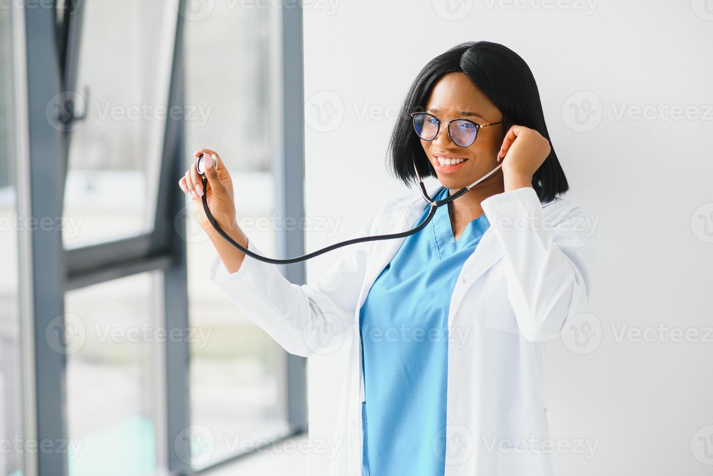 young happy african american medical worker using tablet computer. photo