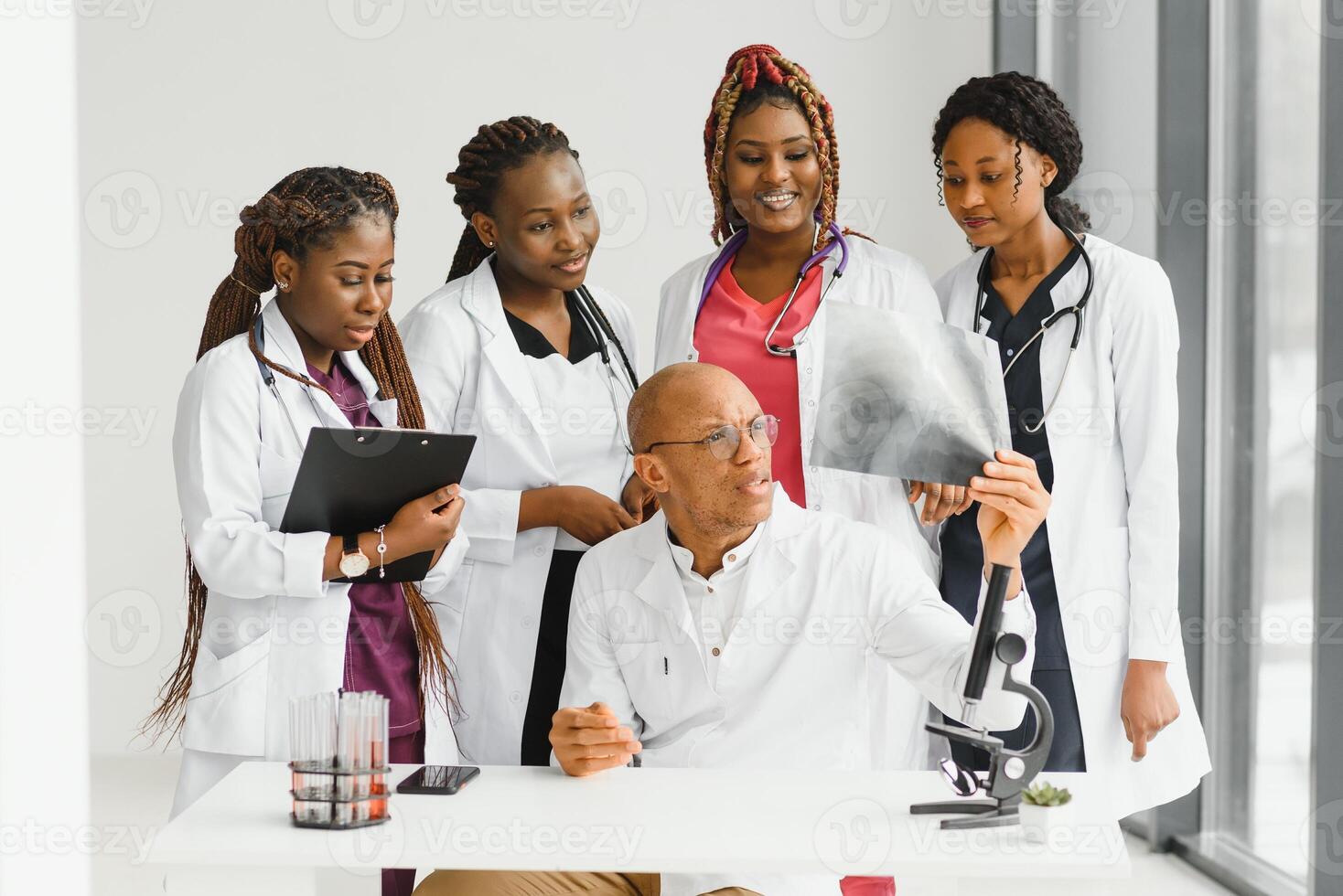 group of young african medical workers on white background. photo