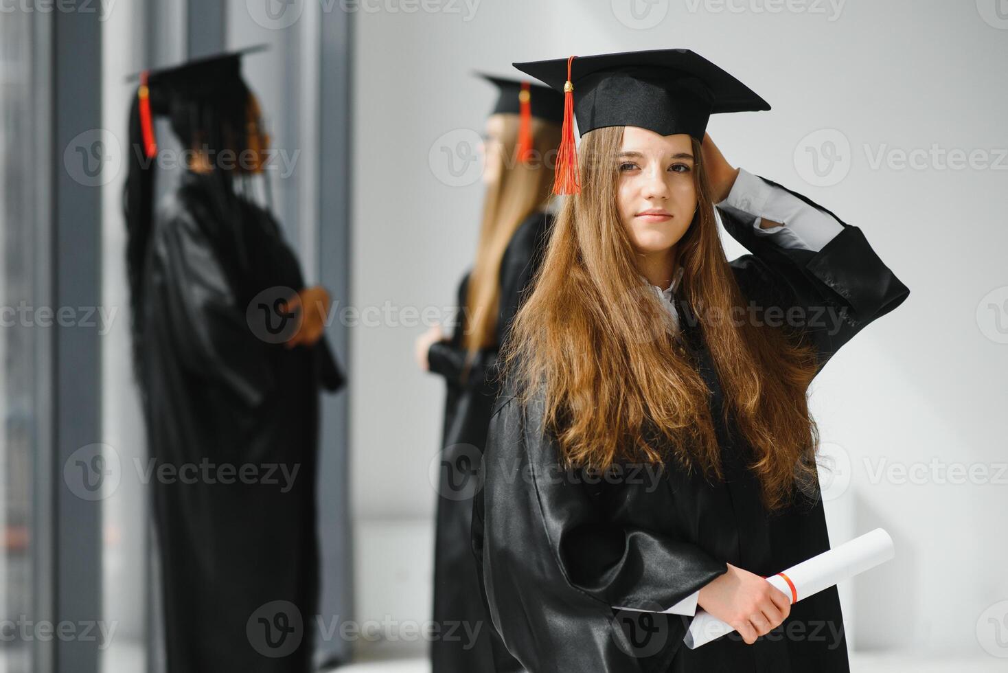 Educational theme graduating student girl in an academic gown. photo