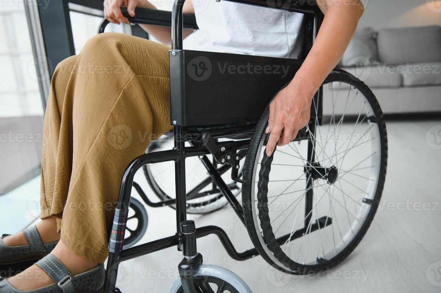 middle aged woman sitting on wheelchair photo