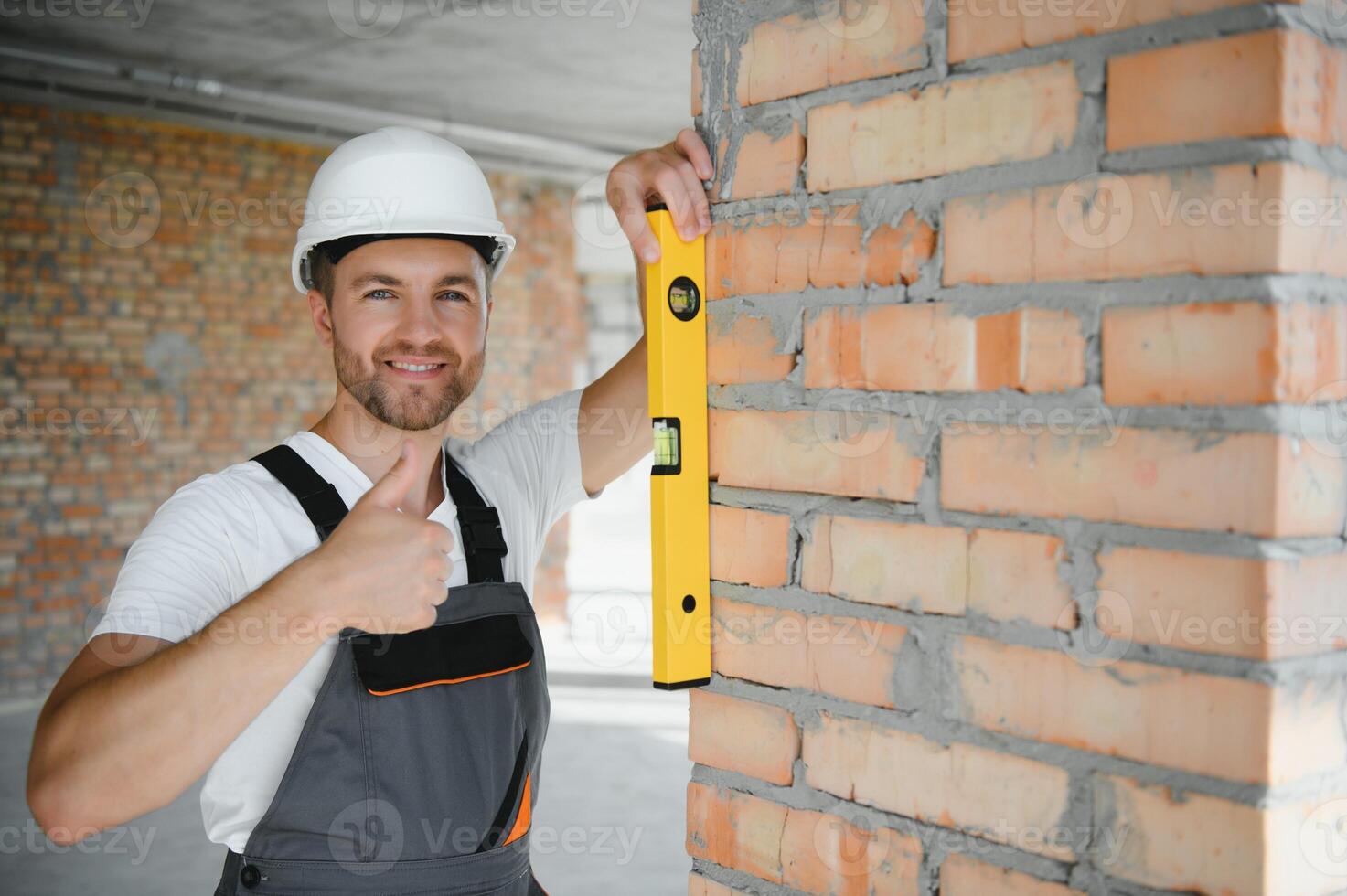 profession, construction and building - male worker or builder in helmet. photo