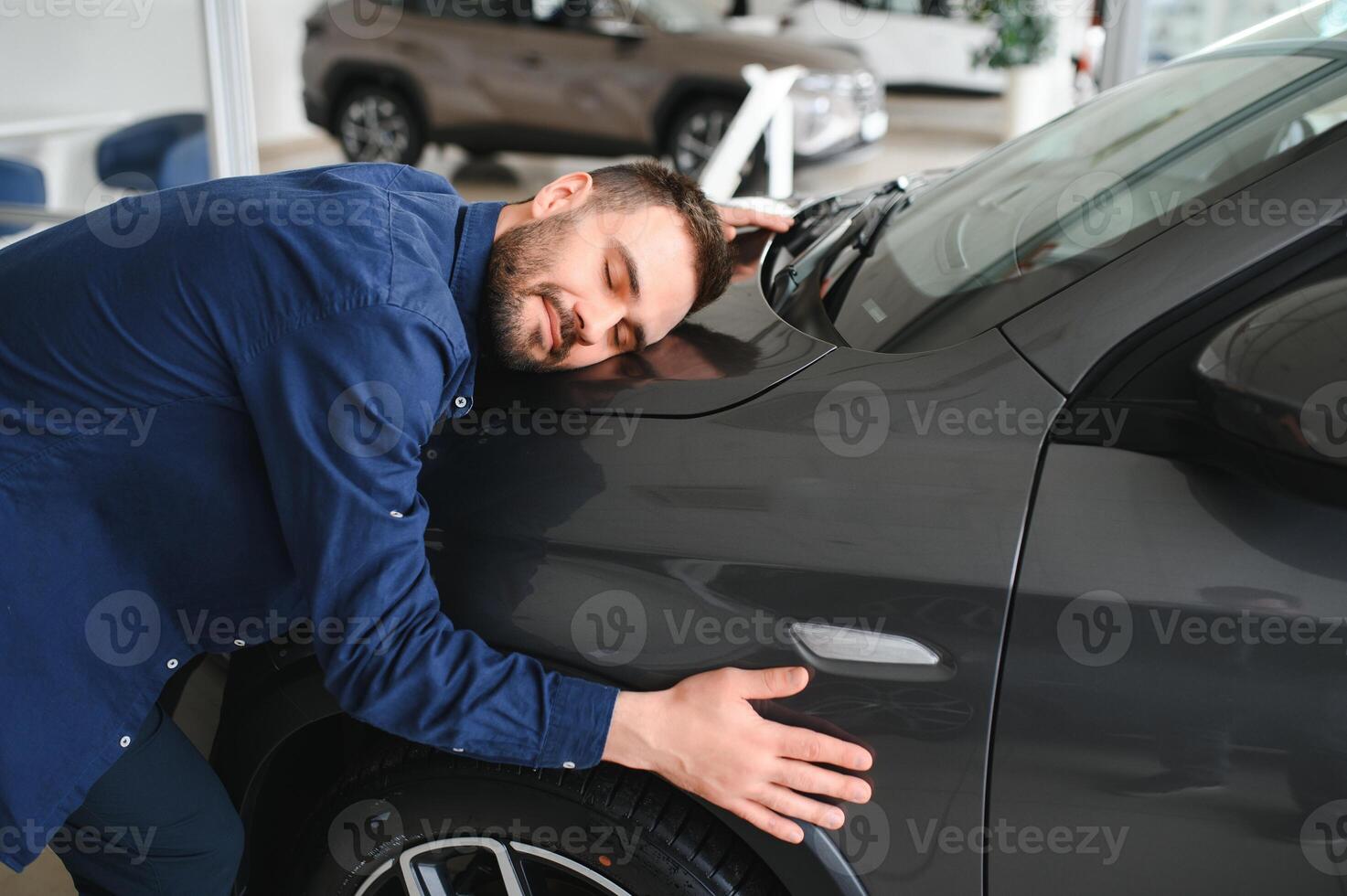 Man customer male buyer client chooses auto wants to buy new automobile photo