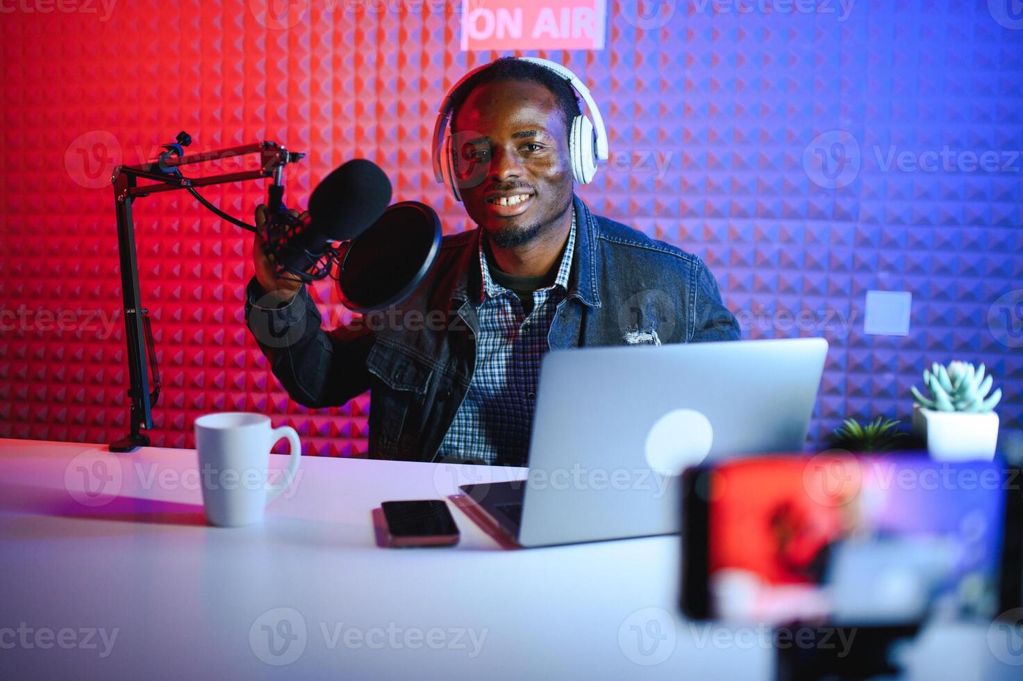 Cheerful young African American male blogger photo