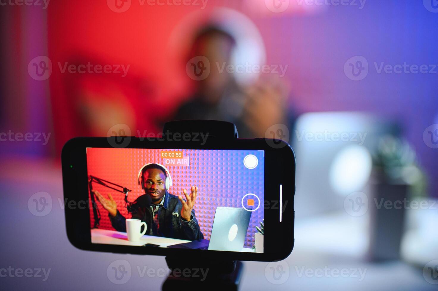 Black male influencer creates material for his internet audience, discussing new trends photo