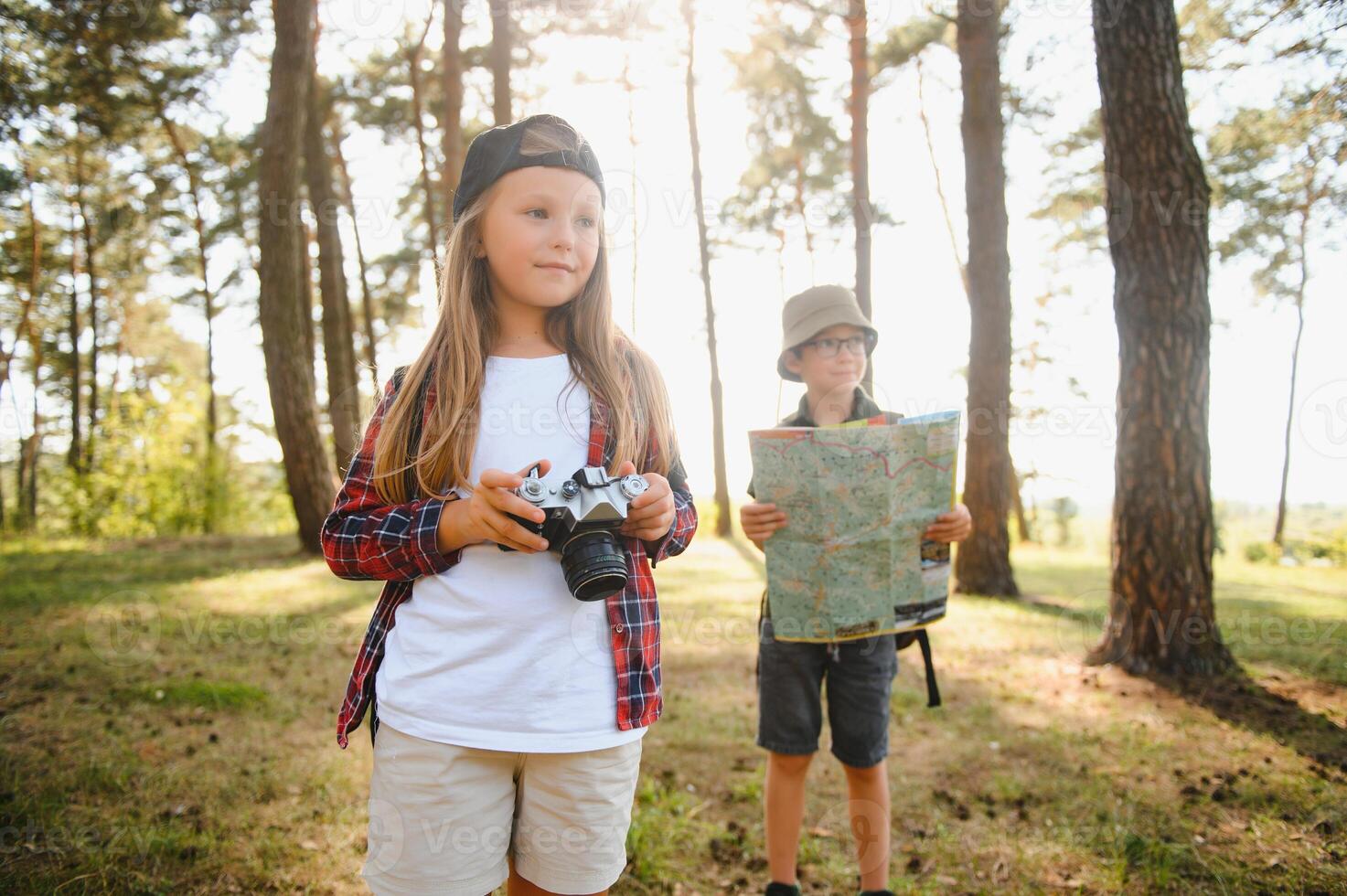 Girl scout frying marshmallows on fire at the woods. photo