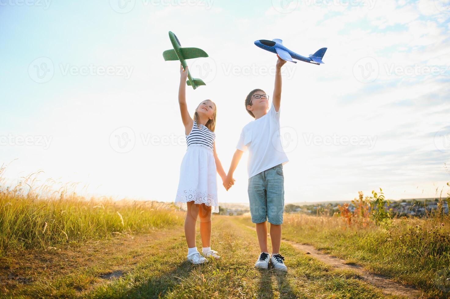children play toy airplane. concept of happy childhood. children dream of flying and becoming a pilot. photo